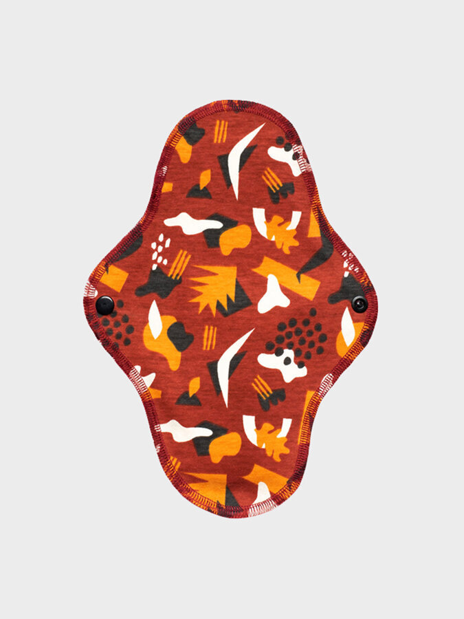 Aisle reusable period pad in a red pattern.