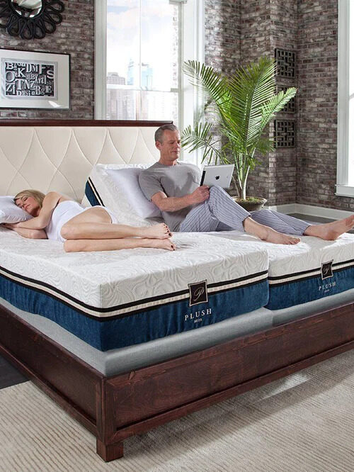 A couple relaxes on a Split King eco friendly memory foam mattress.